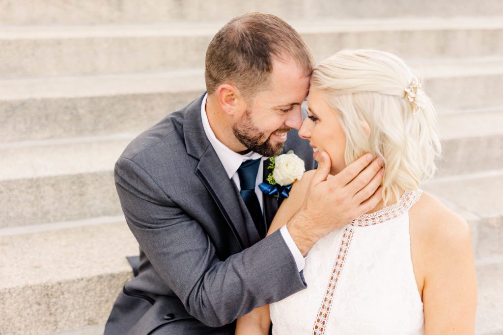 Bride and groom photos at the Kansas State Capitol by Topeka Wedding Photographer Sarah Riner Photography